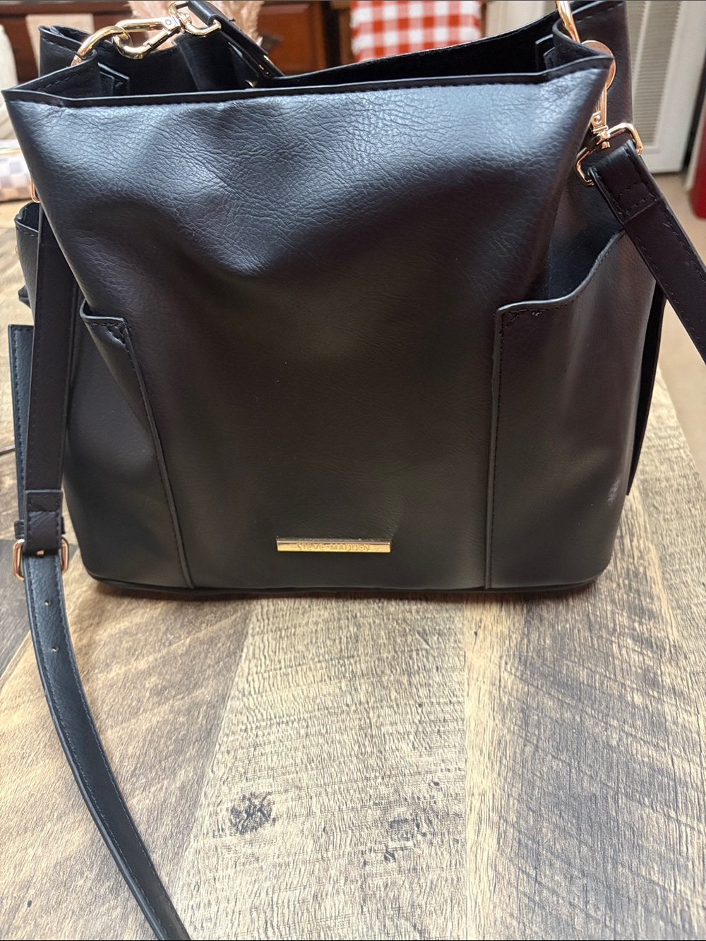 Steve Madden  Shoulder Bag with Gold accent  handles can be worn as a crossbody.